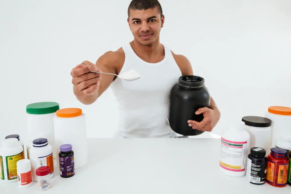 Sportsman standing over Energy Supplements