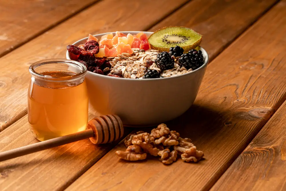 healthy Pre-Workout Snacks for Energy and endurance – honey, oats, kiwi, walnuts, almonds.